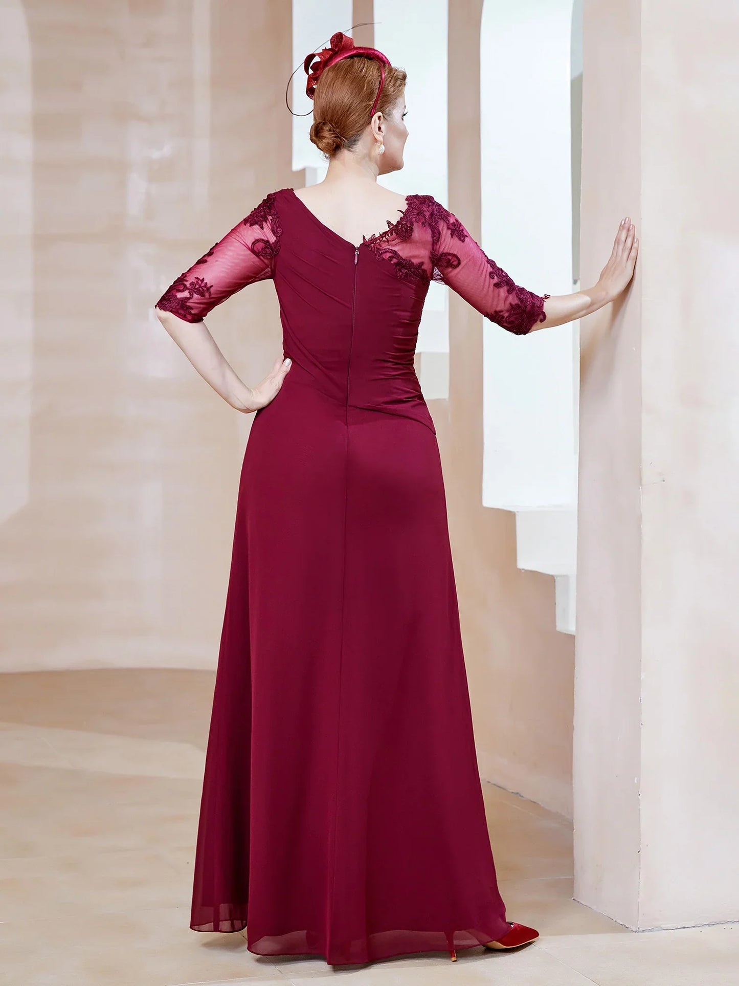 Low round lace neckline with ruffled edges, tight fitting mother of the bride dress