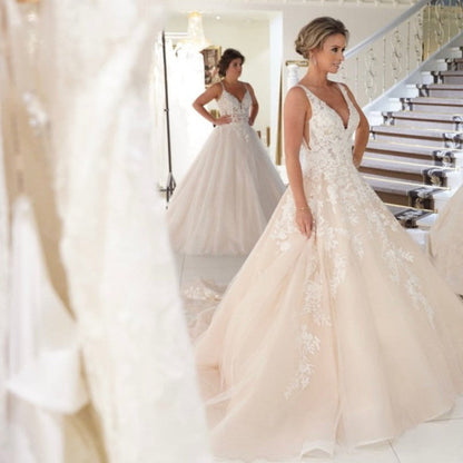 Elegant Backless A-Line Wedding Gown with Deep V-Neck and Spaghetti Straps in Applique Lace