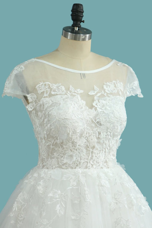 Elegant Floor-length Bateau Wedding Dress with Backless Lace and Tulle Appliques in an A-Line Silhouette